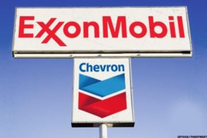 Exxon reports a historic loss while Chevron deepens capex cuts